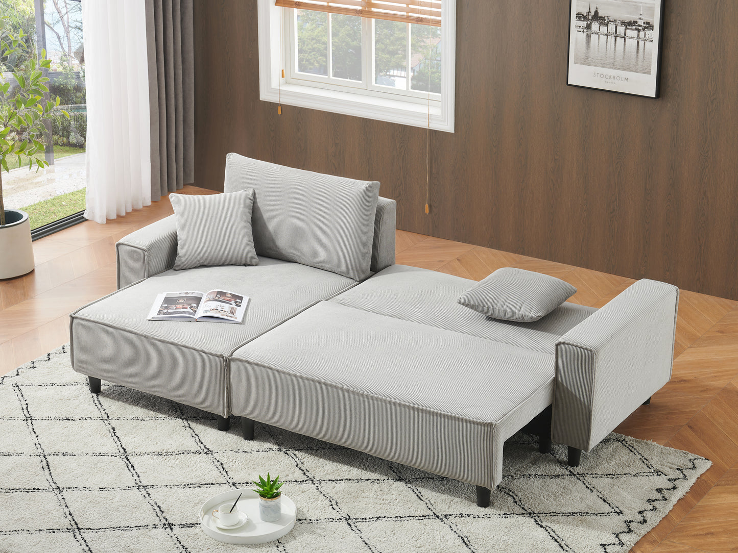 The 93-inch grey corduroy sofa bed comes with two pillows to fit in the living room and the apartment is not overcrowded