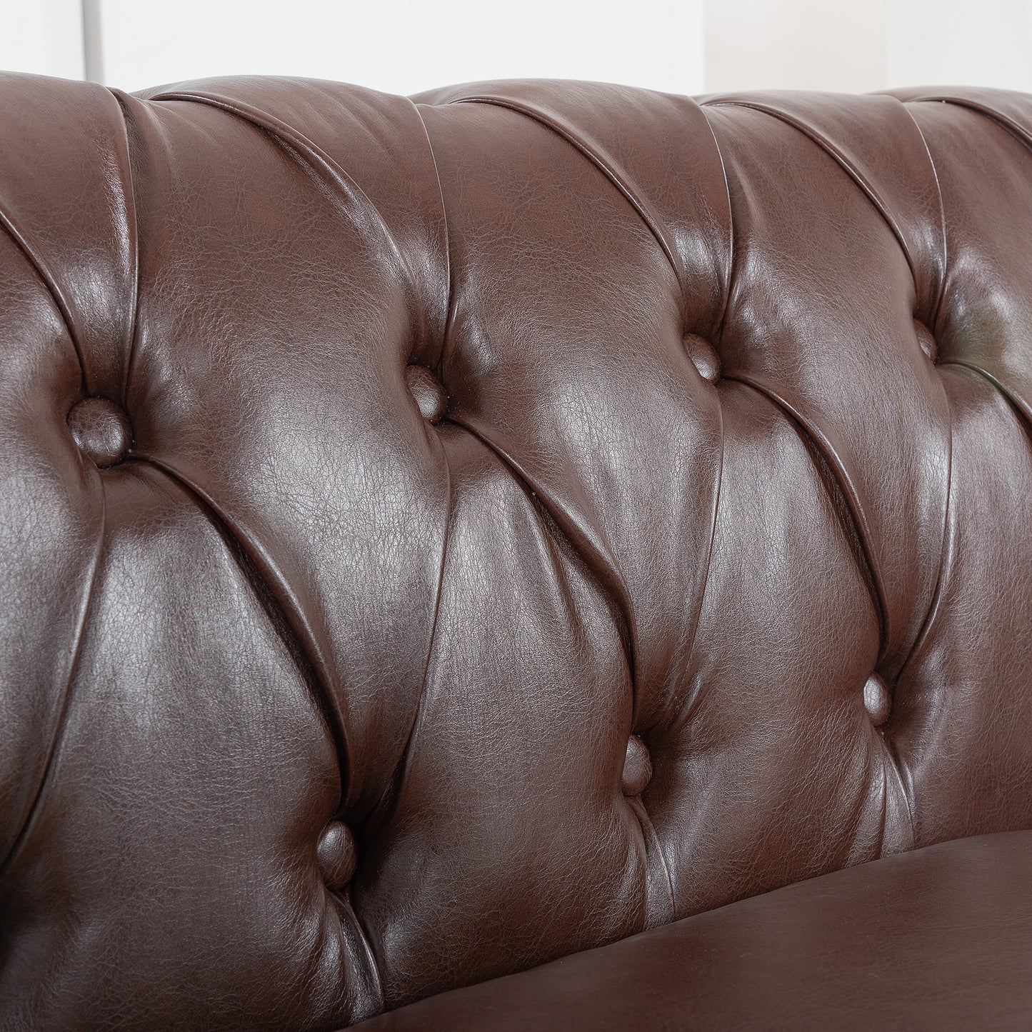 84.65" Dark Brown PU Rolled Arm Chesterfield Three Seater Sofa.