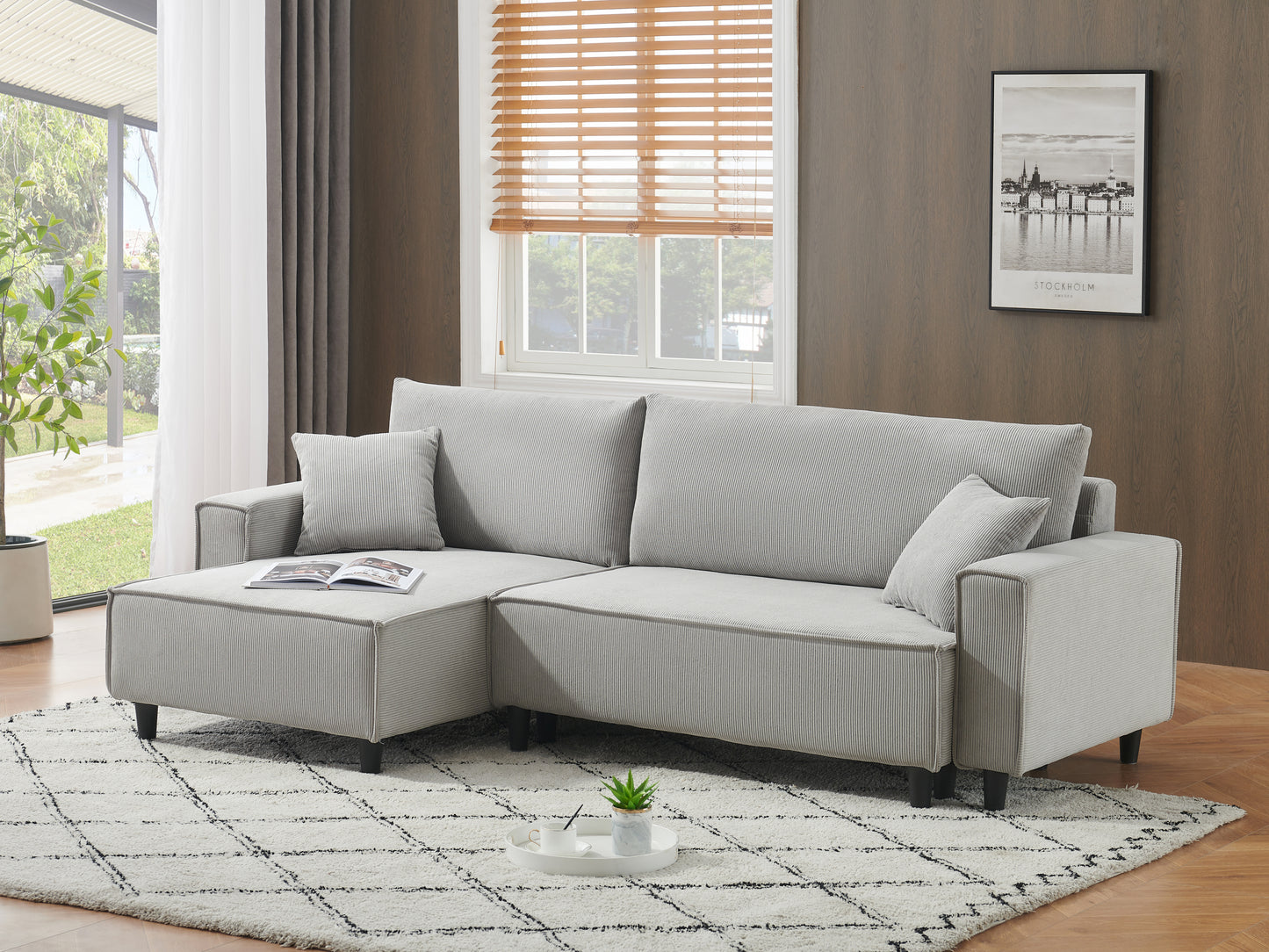 The 93-inch grey corduroy sofa bed comes with two pillows to fit in the living room and the apartment is not overcrowded