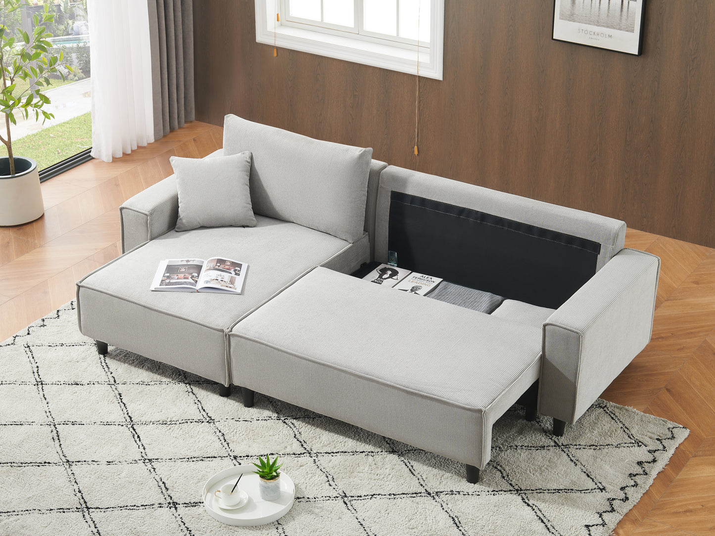 The 93-inch grey corduroy sofa bed comes with two pillows to fit in the living room and the apartment is not overcrowded